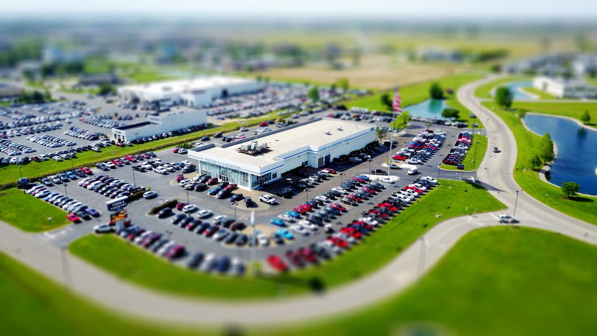 Aerial view of a dealership lot full of inventory